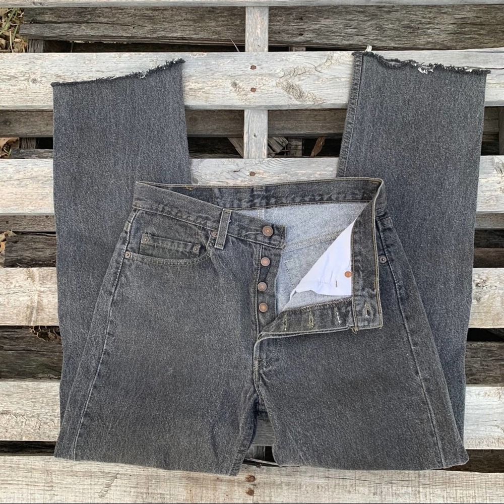 Vintage 90s Levi’s 501XX faded black raw hem jeans